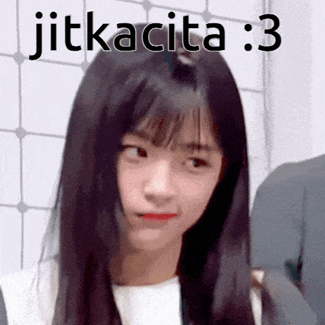a girl with long black hair is making a funny face with the words jitkacita : 3 written above her