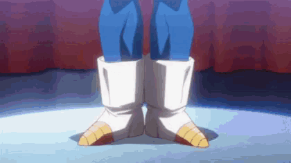 a close up of a person 's feet wearing a pair of white boots