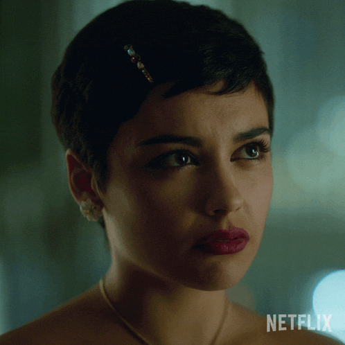 a close up of a woman 's face with the word netflix on the bottom right