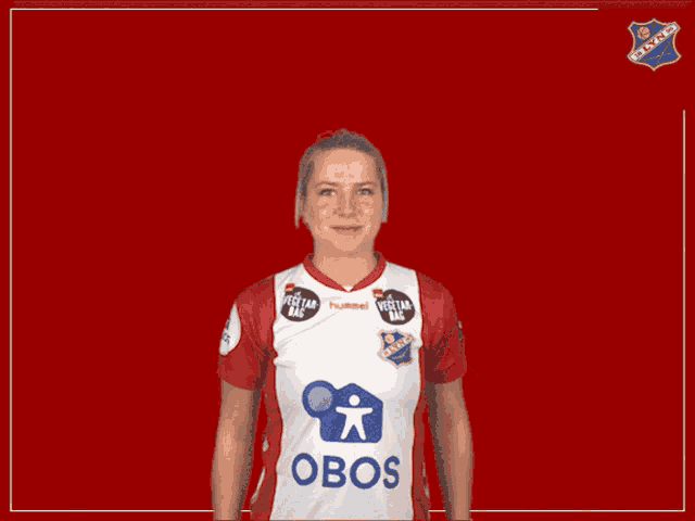 a woman wearing a red and white shirt that says obos on it