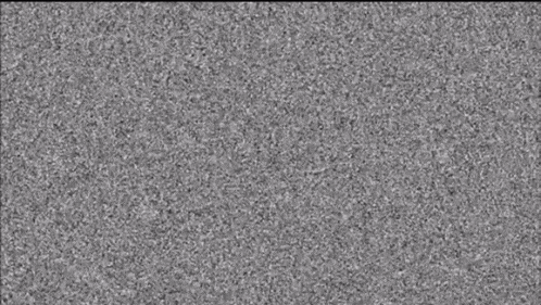 a close up of a gray background with a lot of small dots