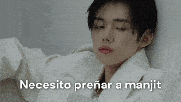 a man in a white jacket with the words necesito prenar a manjit written above him