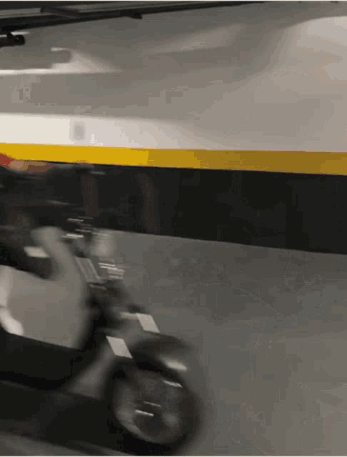 a person is riding a scooter in a garage
