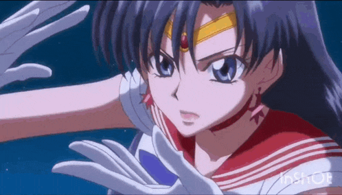 a close up of a girl in a sailor suit with a red and white uniform .