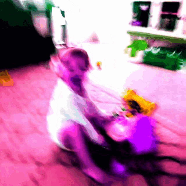 a blurry image of a child playing with a toy