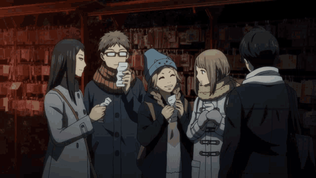 a man and a woman are standing next to each other and the man is wearing a scarf