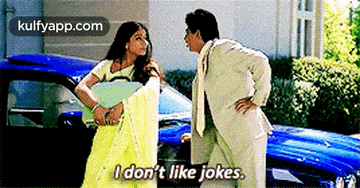 a man and a woman are standing next to each other and the woman says i don t like jokes .