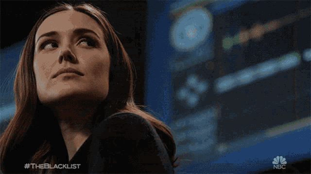 a man in a suit and tie with the blacklist written below him