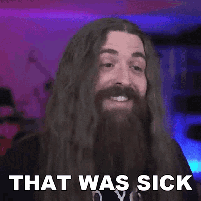a man with long hair and a beard has the words that was sick on his face