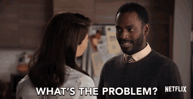 a man and woman are looking at each other and the man says what 's the problem netflix