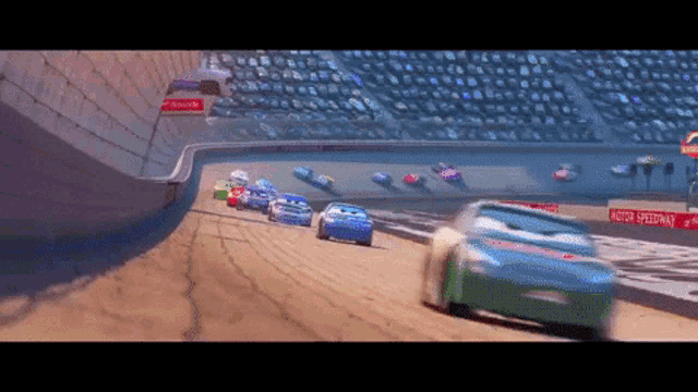 cars racing on a track with a sign that says motor speedway on it