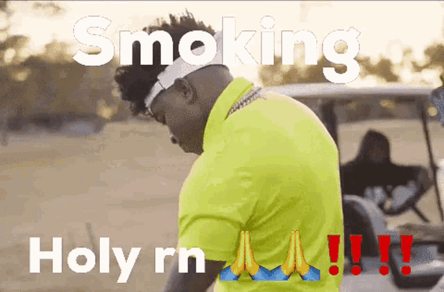 a man in a yellow shirt is praying with the words smoking holy rn behind him