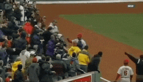 a baseball player wearing a number 8 jersey is surrounded by fans