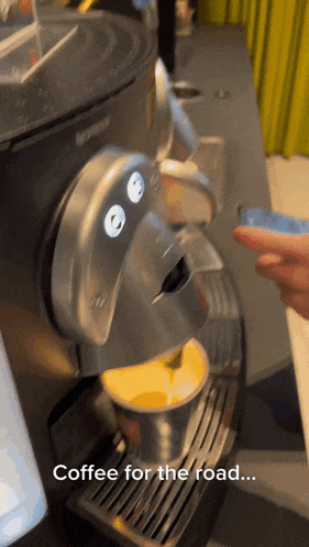 a coffee machine that has the words coffee for the road on it