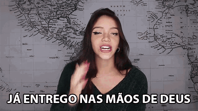 a woman says ja entrego nas mãos de deus in front of a map of the world
