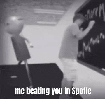 a black and white photo of a boy writing on a blackboard with the caption `` me beating you in spotle '' .