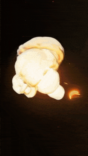 a cartoon explosion with the letter t visible in the center