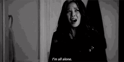 a woman is crying and saying `` i 'm all alone '' in a black and white photo .