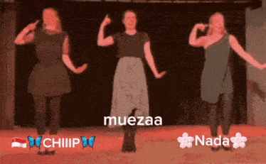 a blurred image of three women dancing with muezaa and nada written on the bottom right