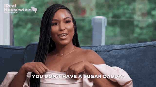 a woman sitting on a couch with the words " you don 't have a sugar daddy "