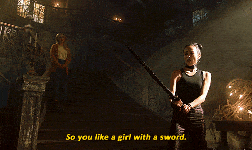 a woman holding a sword with the words so you like a girl with a sword below her