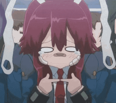 a girl with red hair is making a funny face with her hands on her face