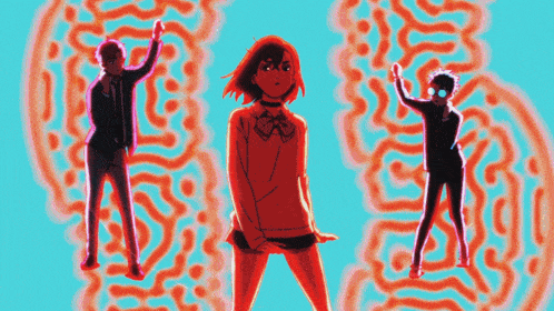three people are standing in front of an orange maze