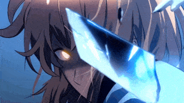 a close up of a person holding a sword in their hand