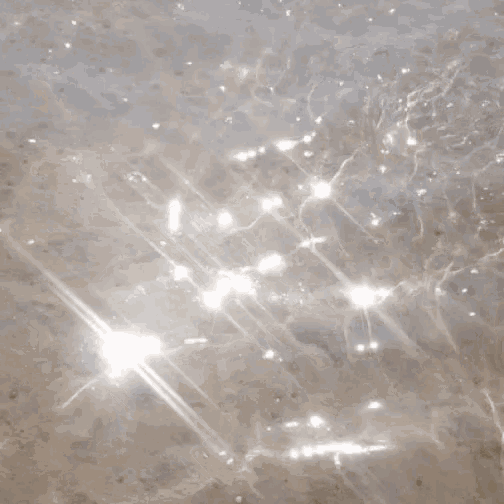 the sun shines through the water and sparkles