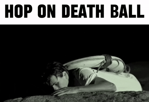 a man laying on a rock with a surfboard on his back with the words hop on death bali above him
