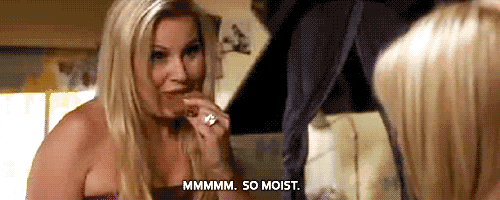 two women are talking to each other and one of them is saying mmmm so moist
