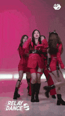 a group of girls are performing a dance with the words relay dance on the bottom