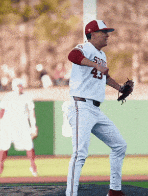 a baseball player wearing a white uniform with the number 43 on it