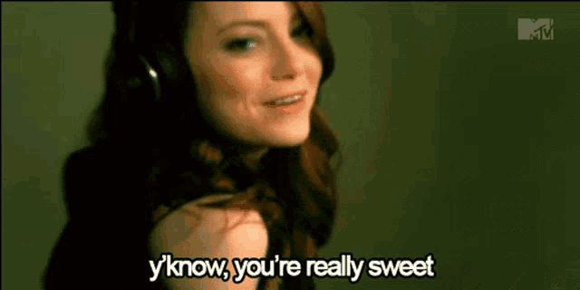 a woman wearing headphones is saying " y'know you 're really sweet "