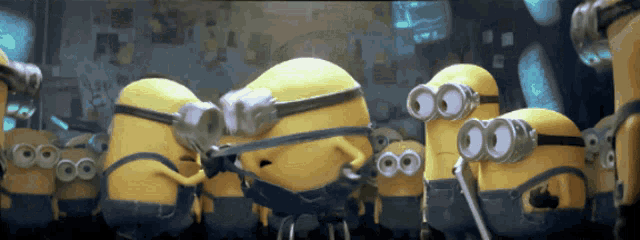 a group of yellow minions with goggles on their eyes