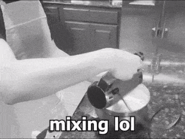 a black and white photo of a person mixing something with the words mixing lol below them