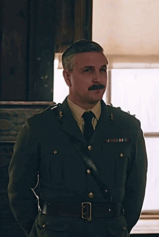 a man in a military uniform with a mustache