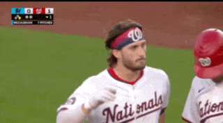 a nationals baseball player wearing a headband with the number 10