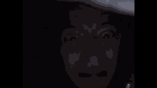 a blurry picture of a person 's face with the name jac cult on the top