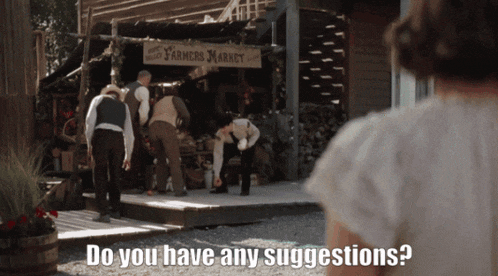 a woman standing in front of a farmers market asking if they have suggestions