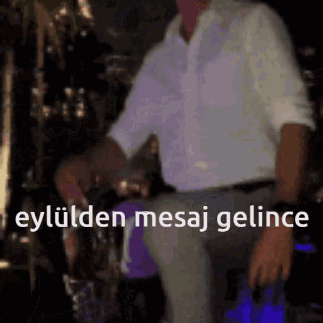 a blurry picture of a man with the words eylulden mesaj gelince written on the bottom