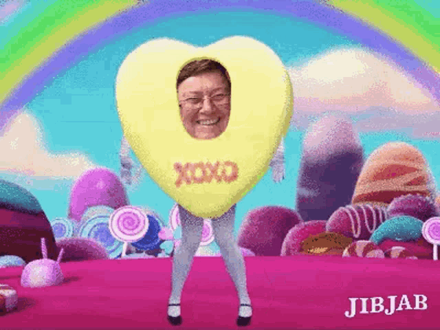 a man is wearing a heart shaped costume with a face in it .