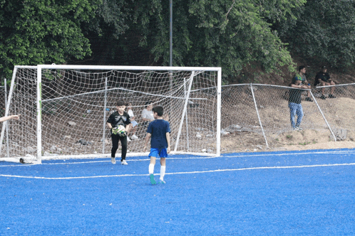 a group of people playing soccer on a field