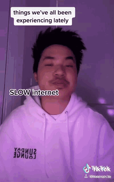 a man wearing a white hoodie with the words things we 've all been experiencing lately slow internet on it