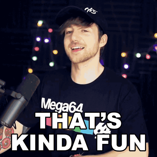 a man is wearing a mega64 shirt and a hat