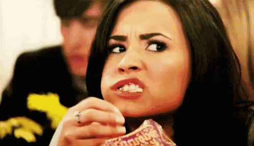 Eat What You Want Day! GIF - Demi Lovato Munch Popcorn GIFs