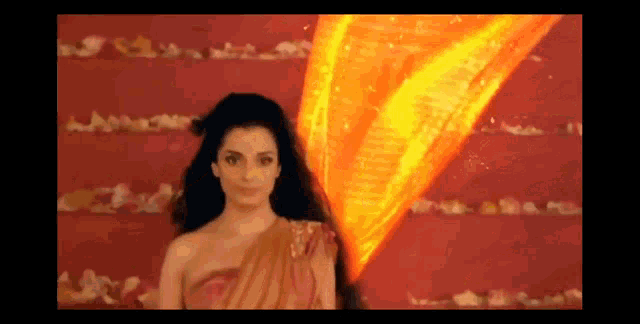 a woman is standing in front of a red wall with a lightning bolt coming from her hair