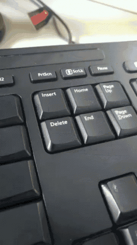 a close up of a keyboard with a delete key