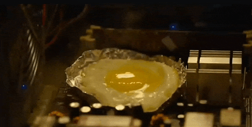 a fried egg on a piece of tin foil