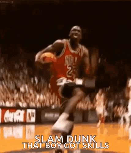 a basketball player is jumping in the air with a basketball in his hand .